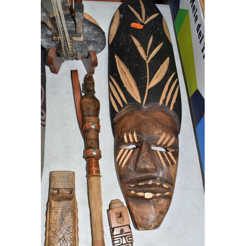 930 - A QUANTITY OF WOODEN INTERNATIONAL ITEMS to include a carved Kalimba with five keys, an ornamental K... 