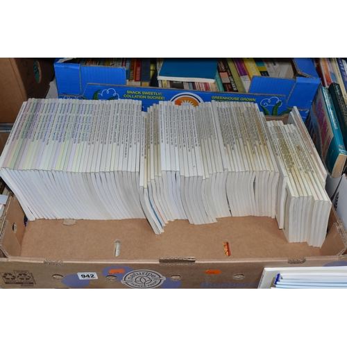 942 - TEN BOXES OF BOOKS ON RELIGION containing several hundred titles in hardback and paperback formats, ... 