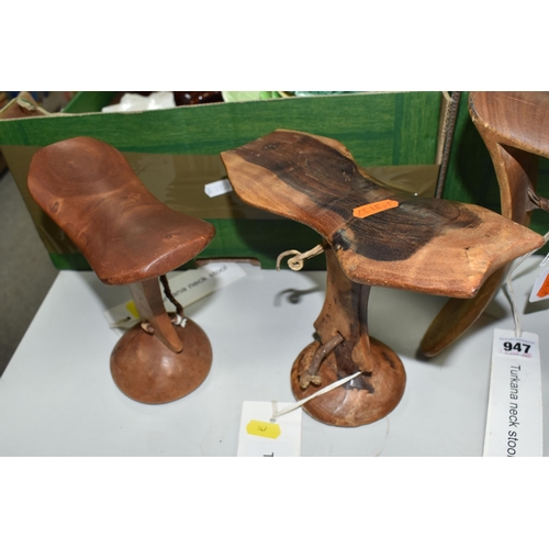 947 - A GROUP OF THREE TURKANA (NORTH WEST KENYAN TRIBE) NECK STOOLS comprising a double-legged, engraved ... 