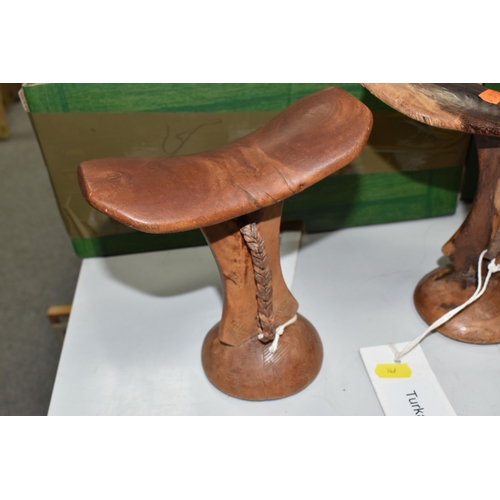 947 - A GROUP OF THREE TURKANA (NORTH WEST KENYAN TRIBE) NECK STOOLS comprising a double-legged, engraved ... 