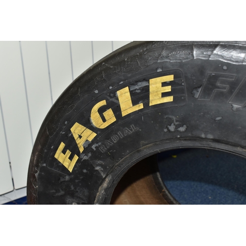 956 - A GOODYEAR EAGLE F1 TYRE, size 26x13, of radial construction, marked for racing purposes only, annot... 