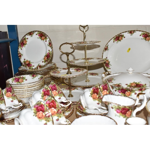 999 - A SIXTY PIECE ROYAL ALBERT 'OLD COUNTRY ROSES' DINNER SERVICE, and five pieces of giftware, comprisi... 