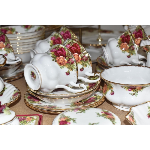 999 - A SIXTY PIECE ROYAL ALBERT 'OLD COUNTRY ROSES' DINNER SERVICE, and five pieces of giftware, comprisi... 