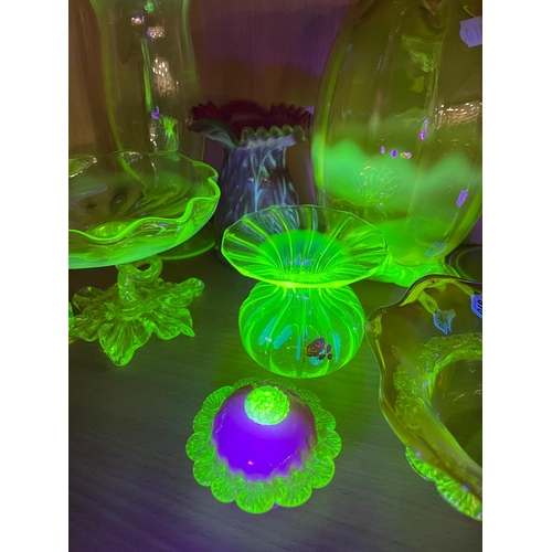 810 - A COLLECTION OF URANIUM GLASS WARES, to include a cranberry and white textured vase with partially c... 