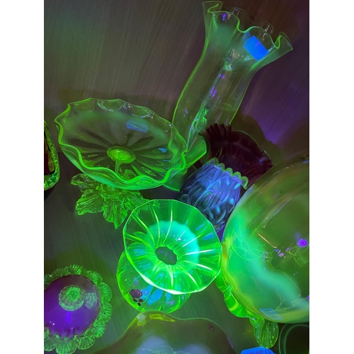 810 - A COLLECTION OF URANIUM GLASS WARES, to include a cranberry and white textured vase with partially c... 