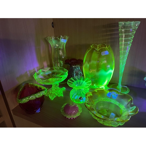 810 - A COLLECTION OF URANIUM GLASS WARES, to include a cranberry and white textured vase with partially c... 