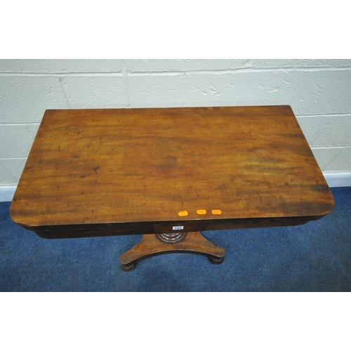 155 - A REGENCY MAHOGANY FOLD OVER CARD TABLE, with a swivel top and storage section, the top enclosing a ... 