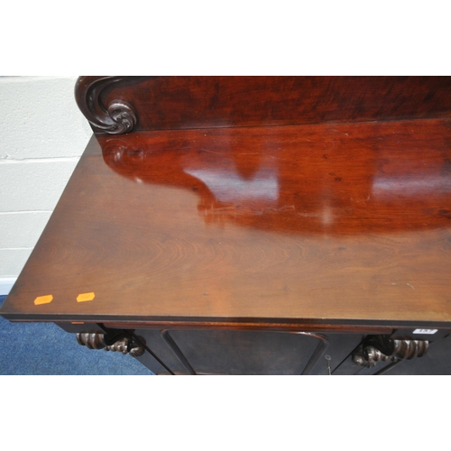 157 - A 19TH CENTURY MAHOGANY SIDEBOARD, with a scrolled raised back, two drawers over double cupboard doo... 