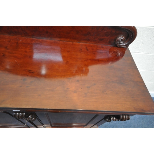 157 - A 19TH CENTURY MAHOGANY SIDEBOARD, with a scrolled raised back, two drawers over double cupboard doo... 