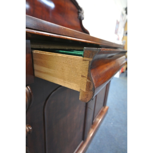 157 - A 19TH CENTURY MAHOGANY SIDEBOARD, with a scrolled raised back, two drawers over double cupboard doo... 