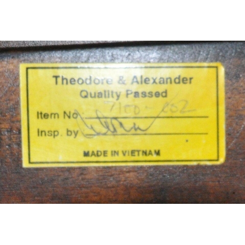 158 - A THEODORE ALEXANDER KAYE CAMPAIGN DESK, with a hinged action top with forward motion writing surfac... 