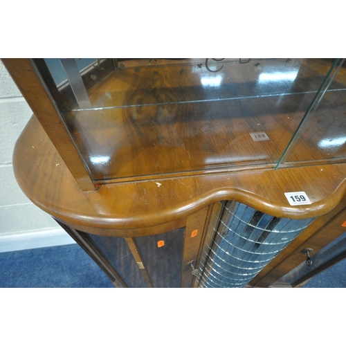 159 - A 20TH CENTURY WALNUT DRINKS CABINET, with double glass sliding doors, above two cupboard doors, fla... 