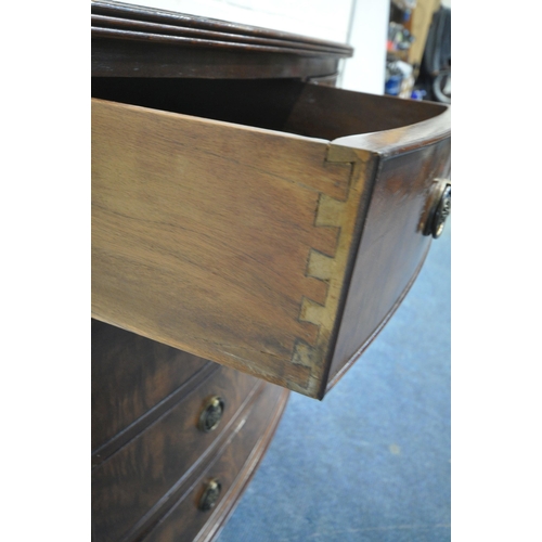 161 - A REPRODUCTION WALNUT AND MAHOGANY BOW FRONT CHEST OF TWO SHORT OVER THREE LONG DRAWERS, raised on c... 