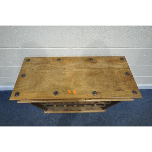 177 - AN EIGHTEEN SECTION HARDWOOD WINE RACK, with metal banding, repeating patterns, on bun feet, width 8... 