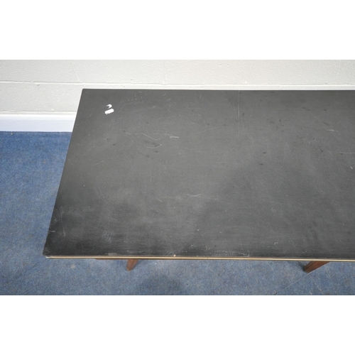 183 - A SCANDINAVIAN STYLE FORMICA TOP FOLD OVER TABLE, the top swivels revealing a storage section, raise... 