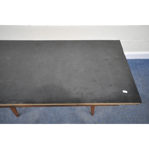 183 - A SCANDINAVIAN STYLE FORMICA TOP FOLD OVER TABLE, the top swivels revealing a storage section, raise... 