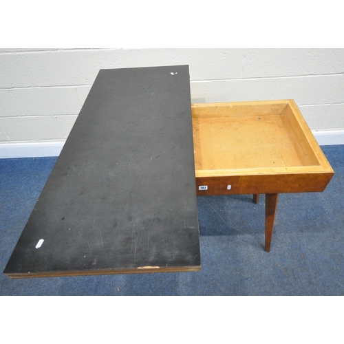 183 - A SCANDINAVIAN STYLE FORMICA TOP FOLD OVER TABLE, the top swivels revealing a storage section, raise... 