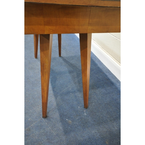 183 - A SCANDINAVIAN STYLE FORMICA TOP FOLD OVER TABLE, the top swivels revealing a storage section, raise... 