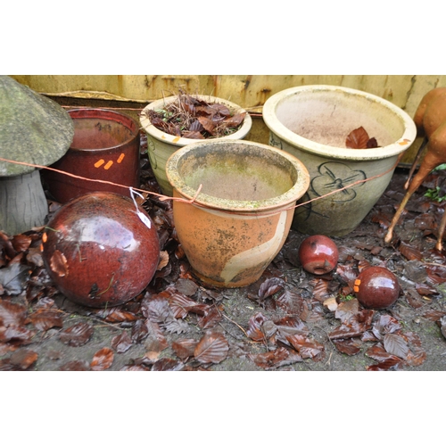 18 - A SELECTION OF GLAZED PLANT POTS AND MUSHROOMS including a wooden and composite mushrooms, three cer... 