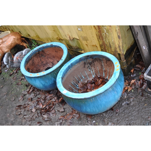 21 - A PAIR OF MODERN GLAZED PLANT POTS, both 51cm in diameter, with a sea green fading glaze (2)