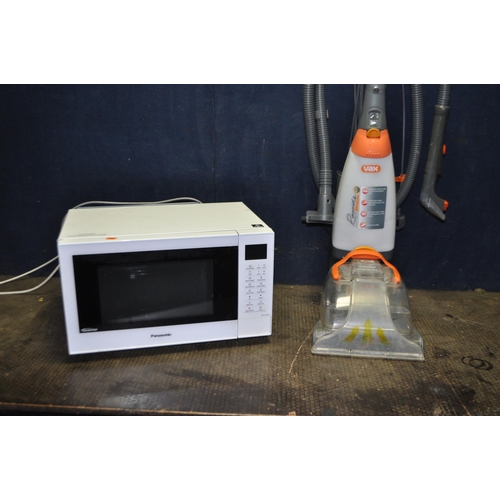 65 - A VAX RAPIDE DE LUXE CARPET WASHER with some accessories and a Panasonic microwave (both PAT pass an... 