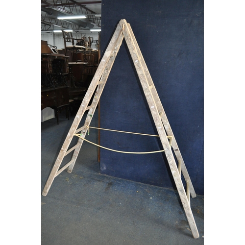 69 - A VINTAGE WOODEN SET OF DECORATORS STEP LADDERS with 6 rungs to each 200cm section