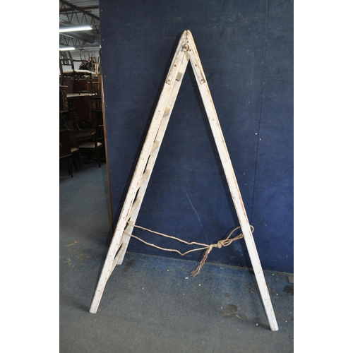 70 - A VINTAGE WOODEN SET OF STEP LADDERS with 7 rungs to each 190cm section