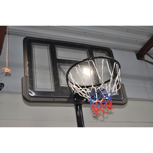 71 - A WATER WEIGHTED BASKETBALL HOOP with backboard, net and spanners to secure, ring height 280cm