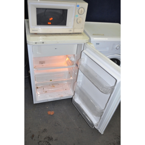 76 - AN INDESIT TFAA10(UK) UNDER COUNTER FRIDGE with icebox width 55cm, depth 60cm height 85cm, along wit... 