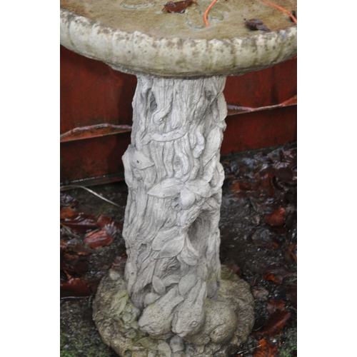 8 - A MODERN COMPOSITE BIRD BATH with a tree trunk effect base and circular top, height 75cm  Condition ... 