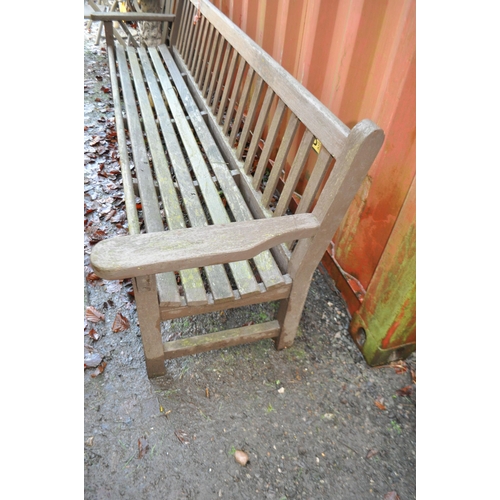 9 - A MID 20th CENTURY HARDWOOD GARDEN/PARK BENCH with slatted seat and back length 254cm