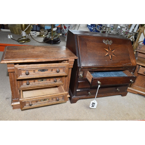 834 - A MINIATURE WRITING BUREAU AND TWO MINIATURE SETS OF DRAWERS comprising a wooden miniature bureau wi... 