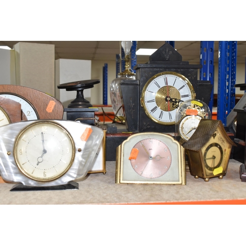 854 - A GROUP OF NINE ASSORTED VINTAGE CLOCKS to include a Juba table clock with a metallic rose face (doe... 