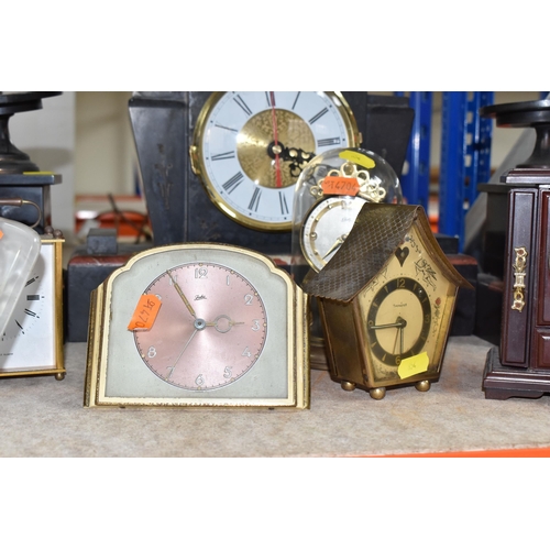 854 - A GROUP OF NINE ASSORTED VINTAGE CLOCKS to include a Juba table clock with a metallic rose face (doe... 