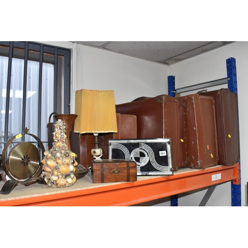 861 - A GROUP OF VINTAGE SUITCASES AND DECORATIVE ITEMS to include four brown leather suitcases of various... 