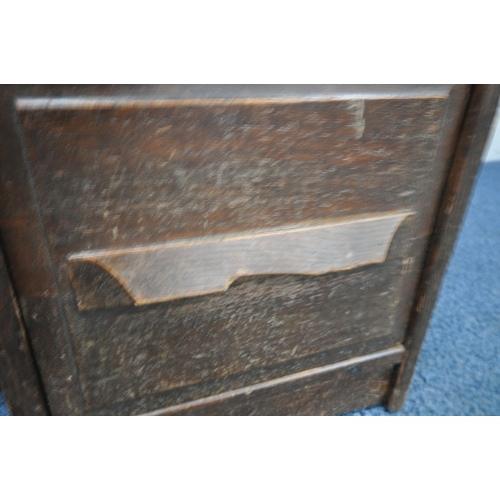 153 - A 20TH CENTURY OAK TAMBOUR FRONT DESK, with a fitted interior, raised on twin pedestals, each with a... 