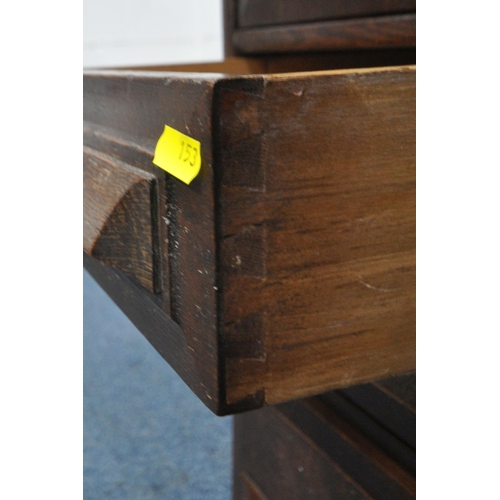 153 - A 20TH CENTURY OAK TAMBOUR FRONT DESK, with a fitted interior, raised on twin pedestals, each with a... 