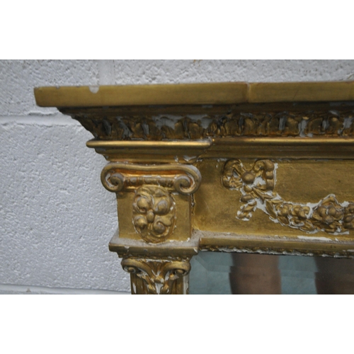 157 - A RECTANGULAR GILT FRAME BEVELLED EDGE OVERMANTEL MIRROR, with a scrolled crest, foliate swags, and ... 