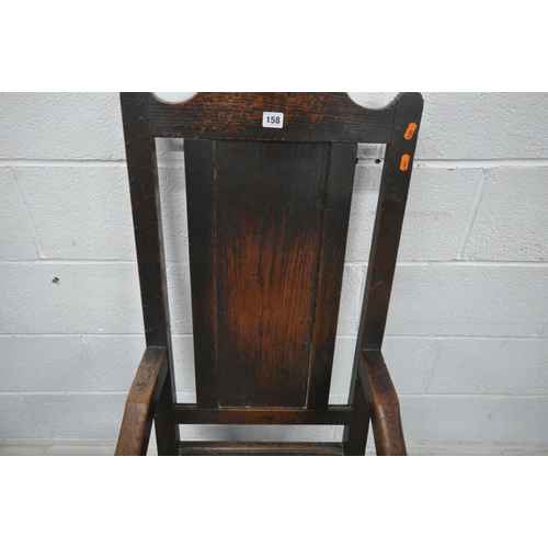 158 - AN 18TH CENTURY OAK WAINSCOTE CHAIR with a high back, scrolled open armrests, raised on turned front... 