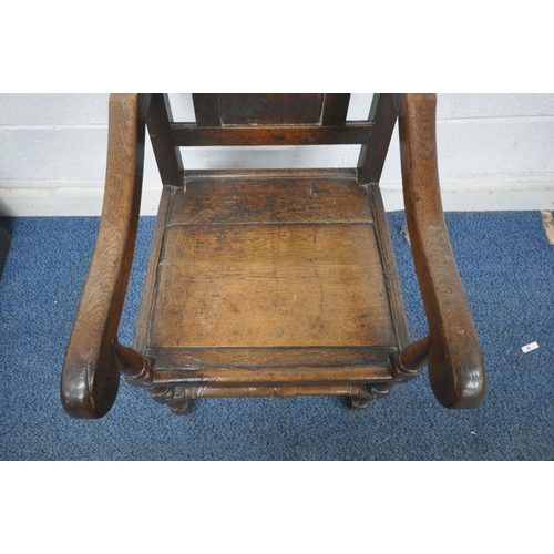 158 - AN 18TH CENTURY OAK WAINSCOTE CHAIR with a high back, scrolled open armrests, raised on turned front... 