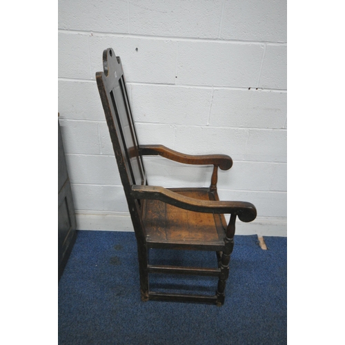 158 - AN 18TH CENTURY OAK WAINSCOTE CHAIR with a high back, scrolled open armrests, raised on turned front... 