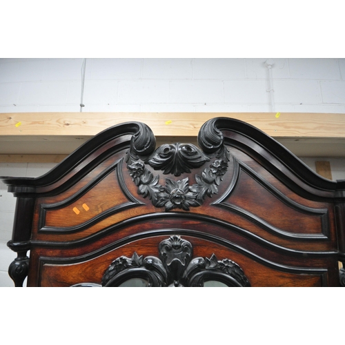 164 - AN EARLY 20TH CENTURY ROSEWOOD ARMOIRE, with a scrolled and foliate details to the crest and the top... 