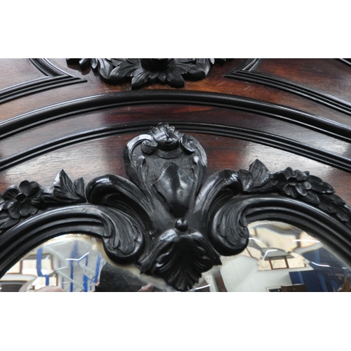 164 - AN EARLY 20TH CENTURY ROSEWOOD ARMOIRE, with a scrolled and foliate details to the crest and the top... 