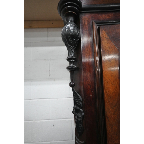 164 - AN EARLY 20TH CENTURY ROSEWOOD ARMOIRE, with a scrolled and foliate details to the crest and the top... 