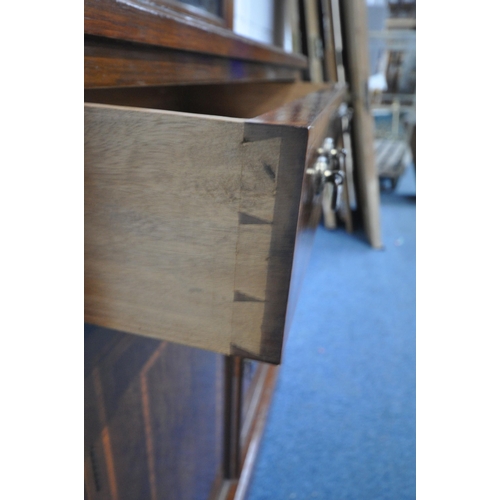 167 - AN EDWARDIAN MAHOGANY BOOKCASE, with double glazed doors, atop a base with a single drawer, above do... 