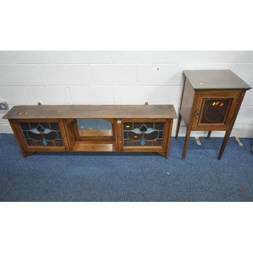 180 - A 20TH CENTURY OAK WALL HANGING SHELF, with two lead glazed doors, flanking a bevelled edge mirror, ... 