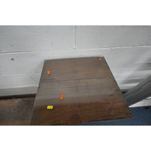 180 - A 20TH CENTURY OAK WALL HANGING SHELF, with two lead glazed doors, flanking a bevelled edge mirror, ... 