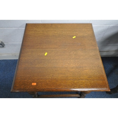 185 - A 20TH CENTURY OAK GATE LEG TABLE, raised on turned legs, open width 150cm x closed width 45cm x dep... 