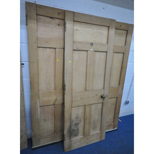 186 - THREE MATCHING PINE DOORS, 76cm x 196cm, along with another pine door, condition report: all with ma... 