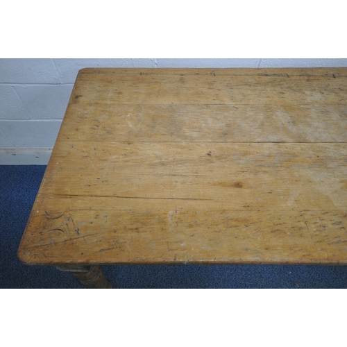 193 - A 19TH CENTURY PINE FARMHOUSE STYLE TABLE, raised on turned and tapered legs, length 182cm x depth 8... 